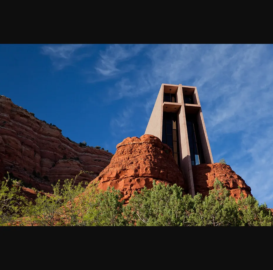 Chapel of the Holy Cross rising from Sedona red rocks against blue sky